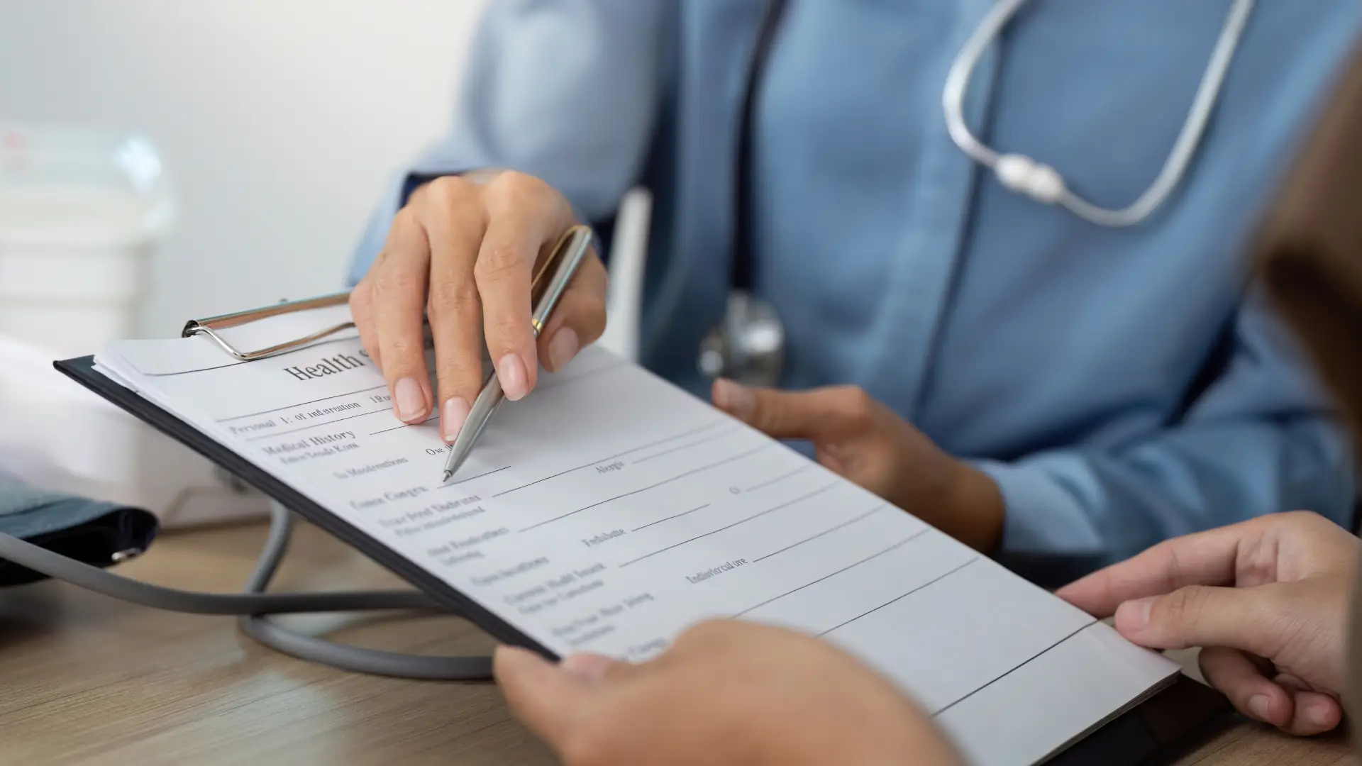 A GP in conversation with a patient during a women's health consultation